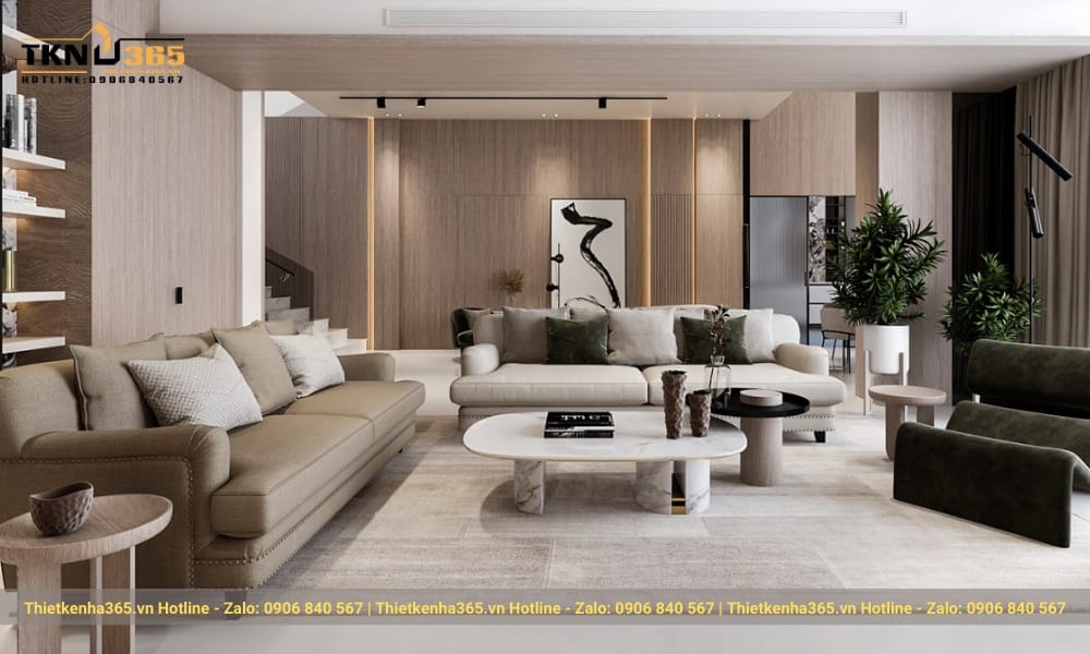 Một chiếc bàn ăn cỡ lớn, với sức chứa lên tới 10 chỗ ngồi, kết hợp với ghế 2 lưng màu xám cùng màu với ghế sofa.