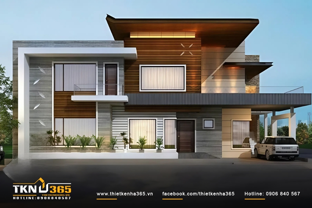 Ngôi nhà ống 2 tầng 2 mặt tiền tận dụng ban công, cửa sổ kính và mái nhà cao hơn để làm mát và tránh cảm giác hầm nóng vào mùa hè