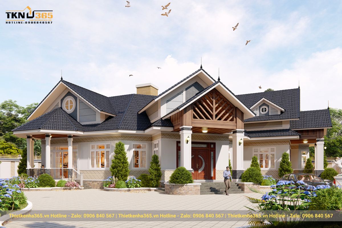 Mẫu thiết kế biệt thự mái thái được bao phủ thêm các tiểu cảnh cây cối xanh