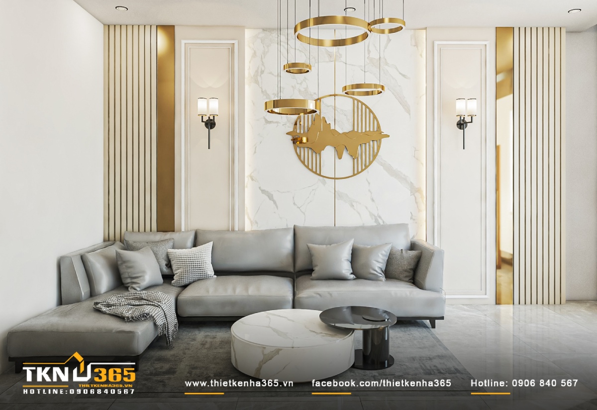 Phòng khách với màu sơn trắng chủ đạo, kết hợp nội thất ghi xám cùng những chi tiết trang trí lấp lánh ánh kim.