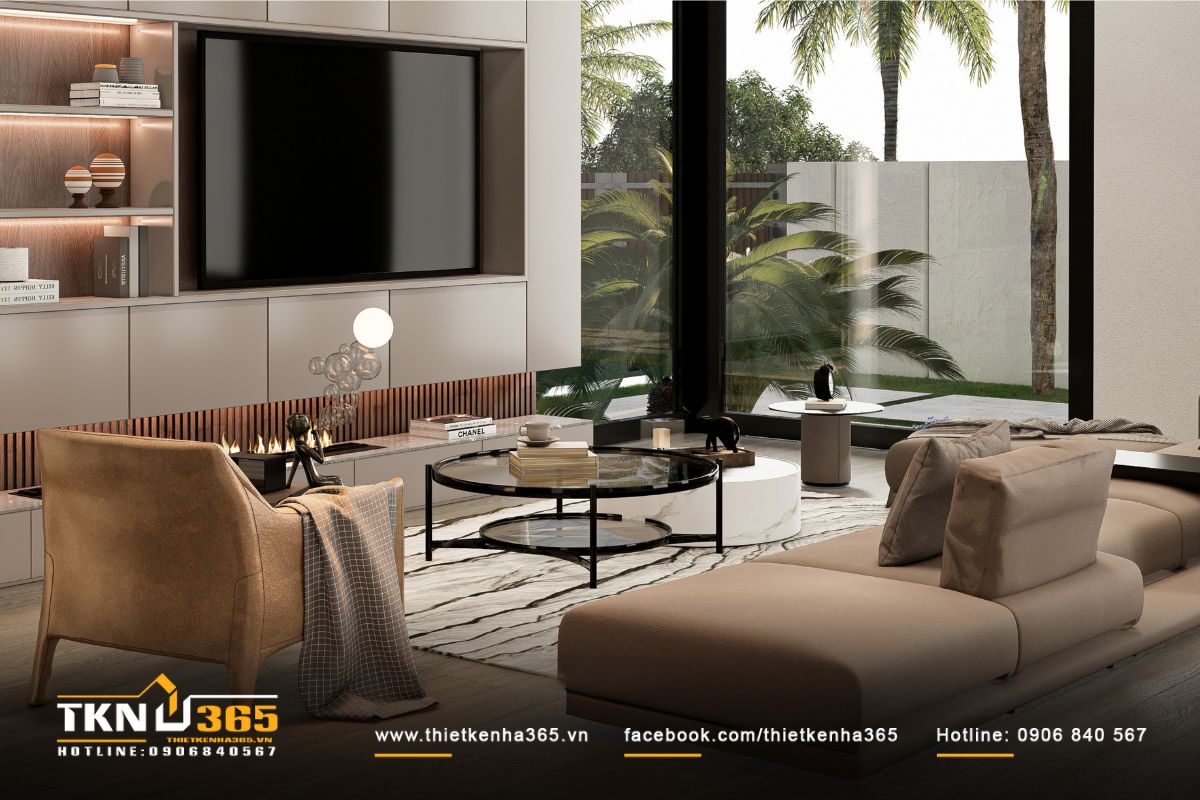 Không gian phòng khách biệt thự 3 tầng bố trí sofa nâu be dạng module và bàn trà đôi hiện đại