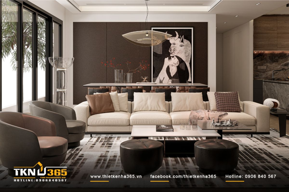 Phòng khách mở rộng tầm nhìn ra vườn và đón ánh sáng tự nhiên vào không gian sống bên trong thông qua cửa kính lớn