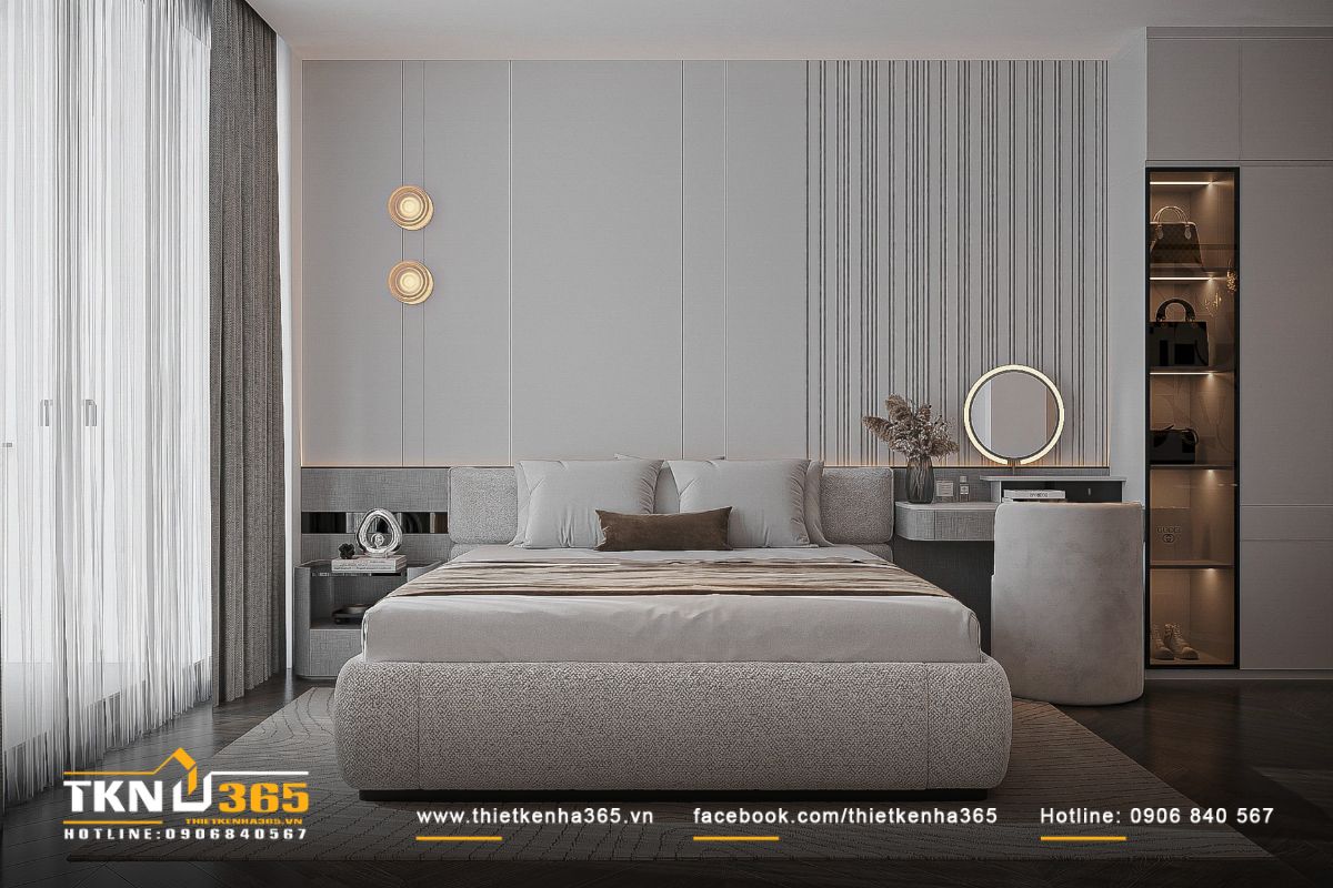 Giường bọc vải boucle dày dặn nối liền bàn trang điểm, đường nét bo cong tinh tế giúp tổng thể trở nên uyển chuyển