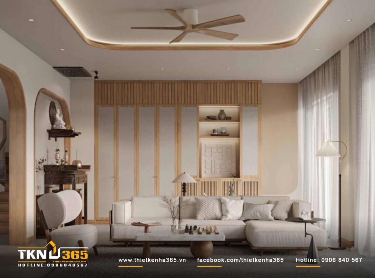 Góc nhìn tổng thể phòng khách cho thấy sự thống nhất trong thiết kế, từ trần cong, vòm tường đến các chi tiết nội thất đều đồng điệu về hình khối