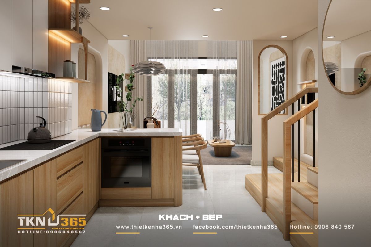 Góc nhìn từ bếp hướng ra phòng khách với ánh sáng len lỏi qua rèm voan mỏng nhẹ