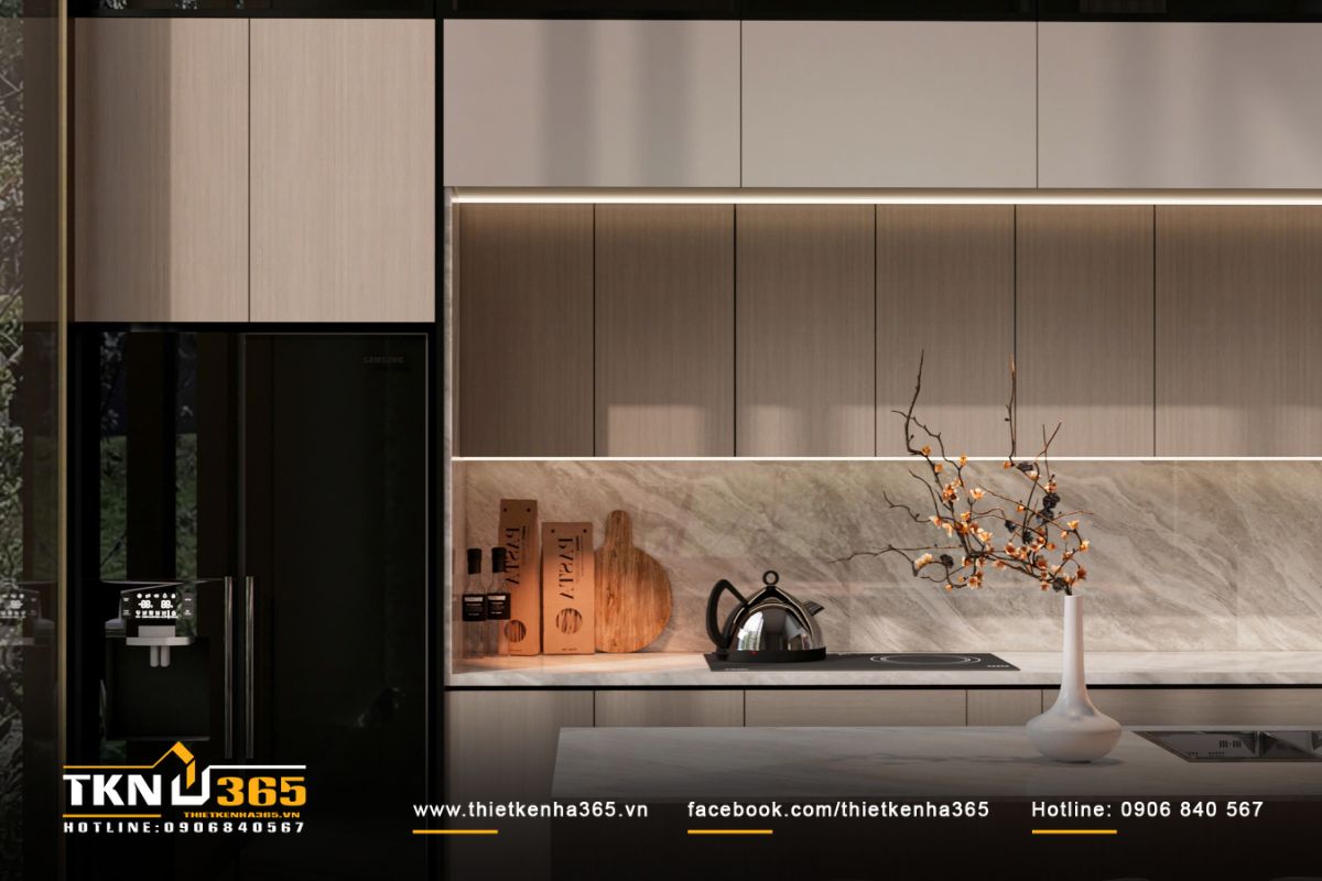 Bề mặt đá vân lớn đồng bộ giữa đảo và tường bếp, giúp không gian liền mạch, dễ vệ sinh và bền vững theo thời gian