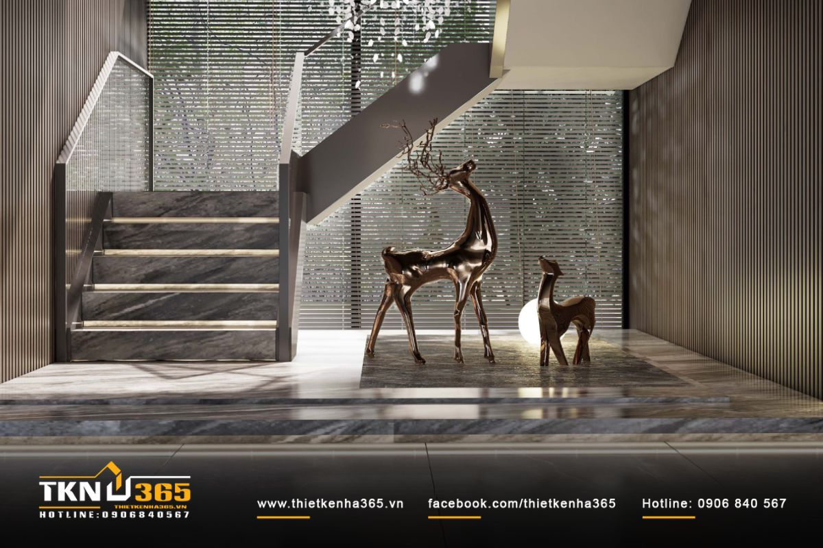 Lan can kính trong suốt và tượng hươu ánh đồng đặt dưới cầu thang trở thành điểm nhấn nghệ thuật, kết nối các khu vực chức năng theo chiều dọc