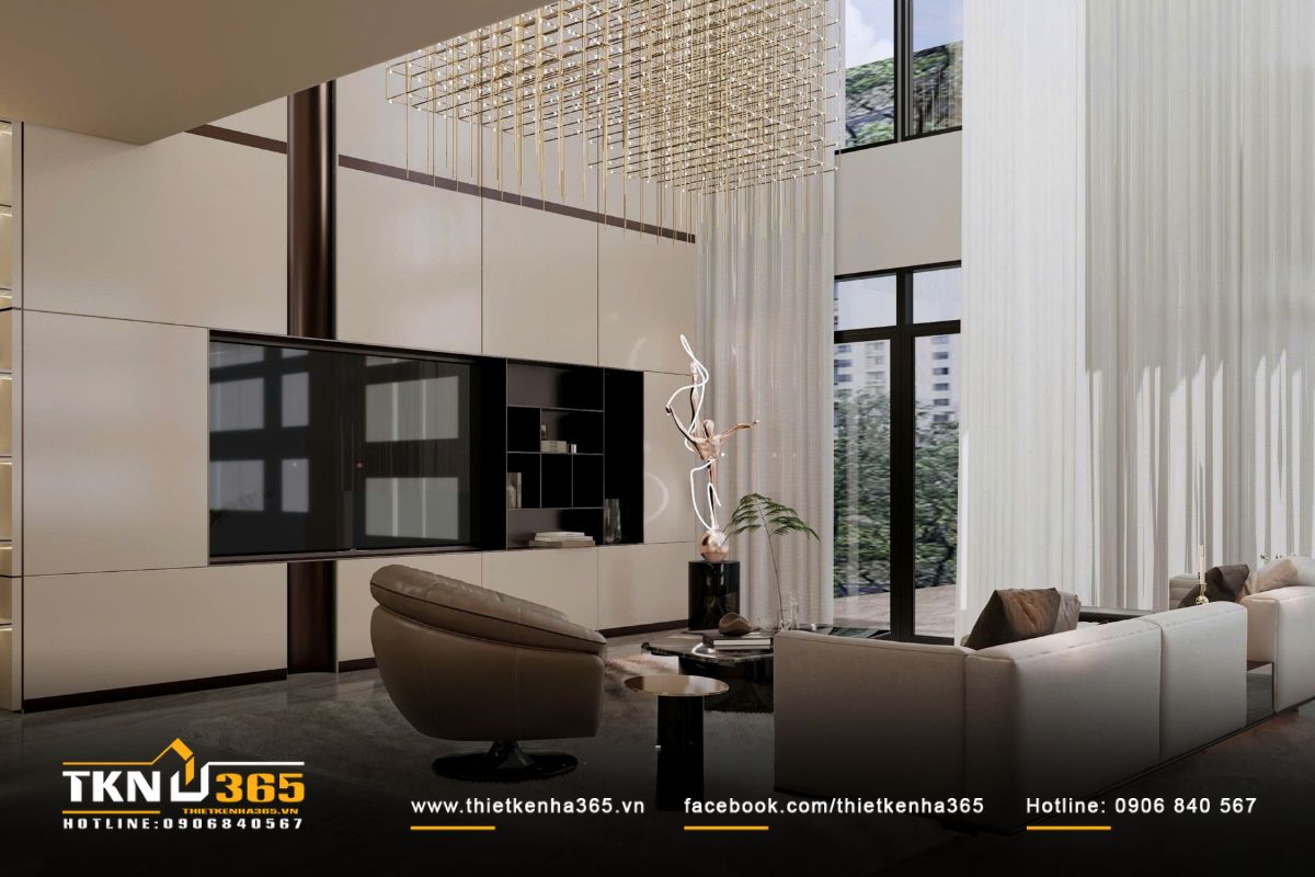 Phòng khách thông tầng rộng thoáng, đón ánh sáng tự nhiên qua hệ cửa kính lớn