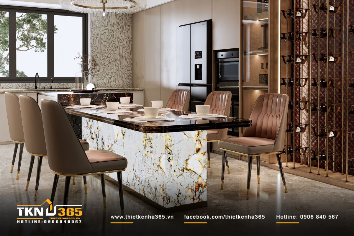 Bàn ăn lớn đặt cạnh tủ rượu, nơi ánh sáng hắt từ đèn âm tường làm nổi bật từng chi tiết vật liệu