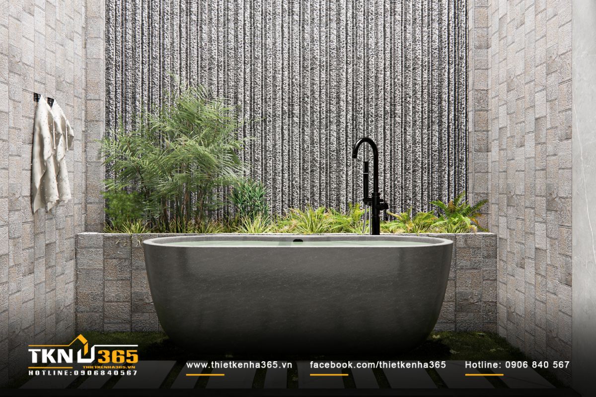 Bồn tắm đá nguyên khối đặt giữa không gian xanh, kết nối hài hòa với thiên nhiên ngoài trời