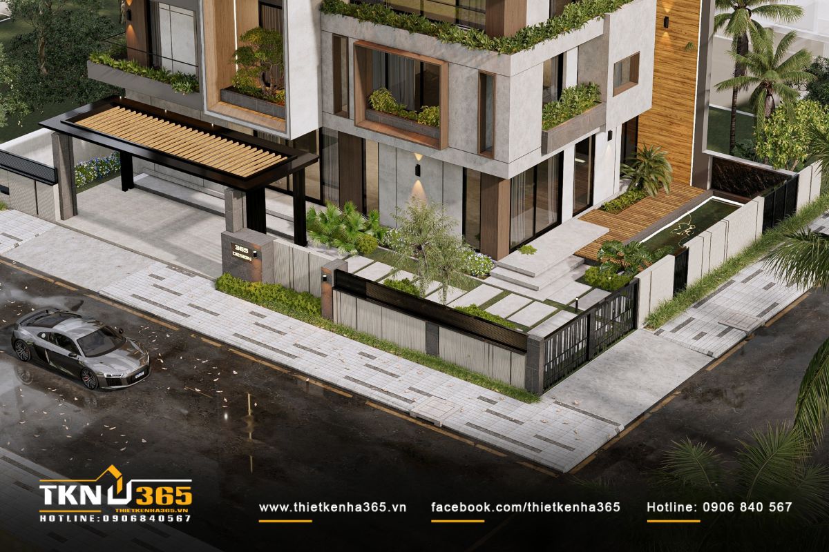 Sân vườn bên hông nhà mở rộng không gian sinh hoạt, kết nối liền mạch với phòng khách qua hệ cửa kính lớn