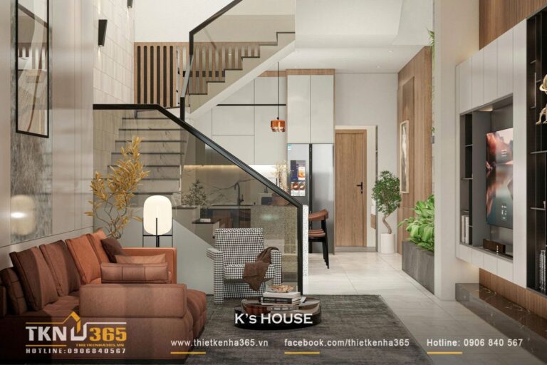 Phòng khách tận dụng ánh sáng tự nhiên từ giếng trời, kết hợp lam gỗ và tường đá sáng giúp không gian luôn thoáng đãng và ấm áp