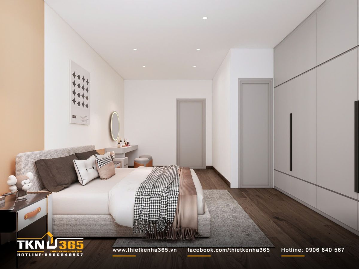 Giường đặt ở trung tâm, hai bên cân đối bàn trang điểm và tủ đầu giường, mang lại bố cục hài hòa