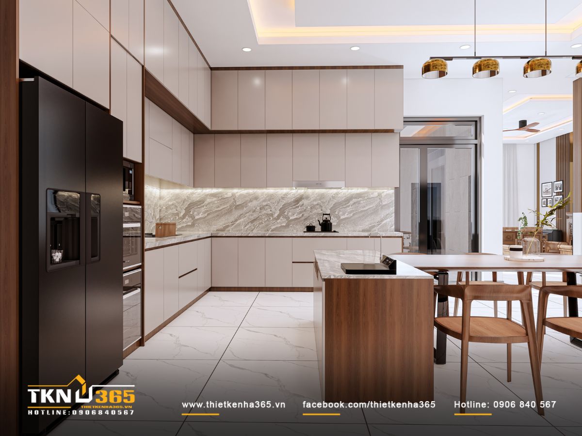 Khu vực bếp - ăn sử dụng đá marble vân lớn và tủ màu kem giúp không gian sáng, rộng và tinh tế