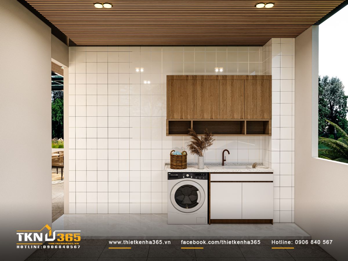 Khu giặt tiện dụng đặt cạnh sân thượng, kết hợp tủ gỗ và mặt bàn đá terrazzo gọn gàng, tiện lợi cho sinh hoạt của cả gia đình