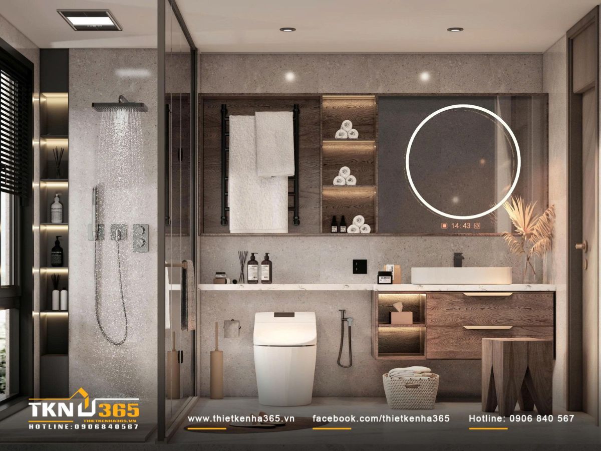 Phòng tắm với nền đá xám đồng nhất và tủ gỗ âm tường có đèn LED, tạo cảm giác sạch sẽ và sang trọng