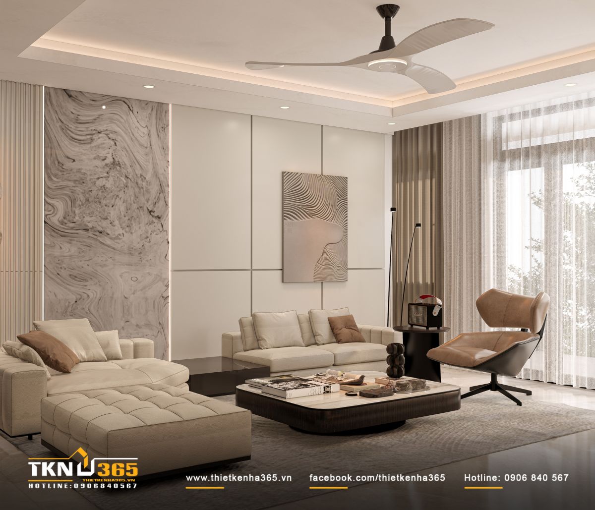 Bộ sofa chữ L và ghế đôn tông kem gọn gàng, hiện đại, phân chia rõ ràng không gian tiếp khách