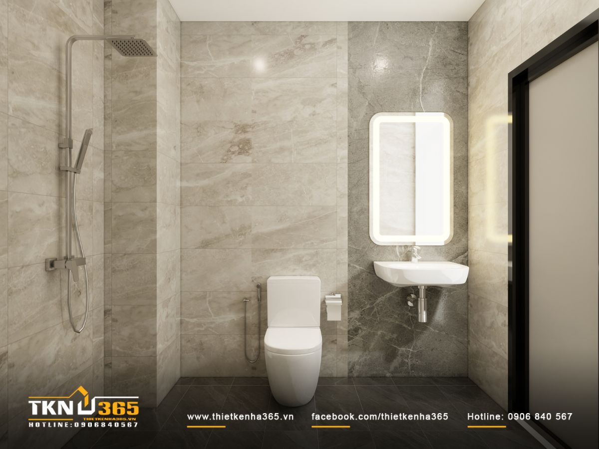 Tường ốp đá xám vân nhẹ giữ phòng tắm sáng và sạch, khu vực tắm đứng đặt gọn một bên giúp không gian rộng thoáng