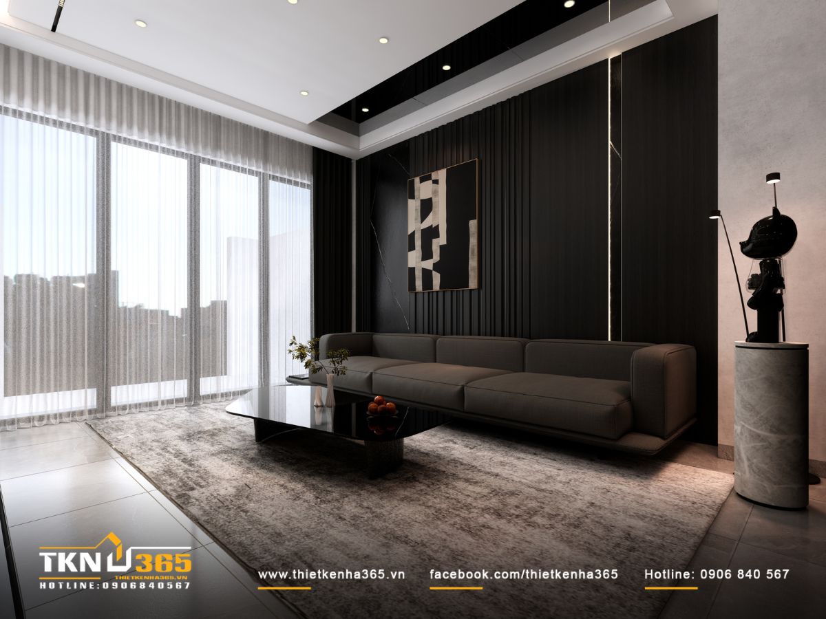 Bàn trà mặt kính đen và tranh trừu tượng màu sắc trung tính giúp tổng thể phòng khách cân bằng và tránh rối mắt