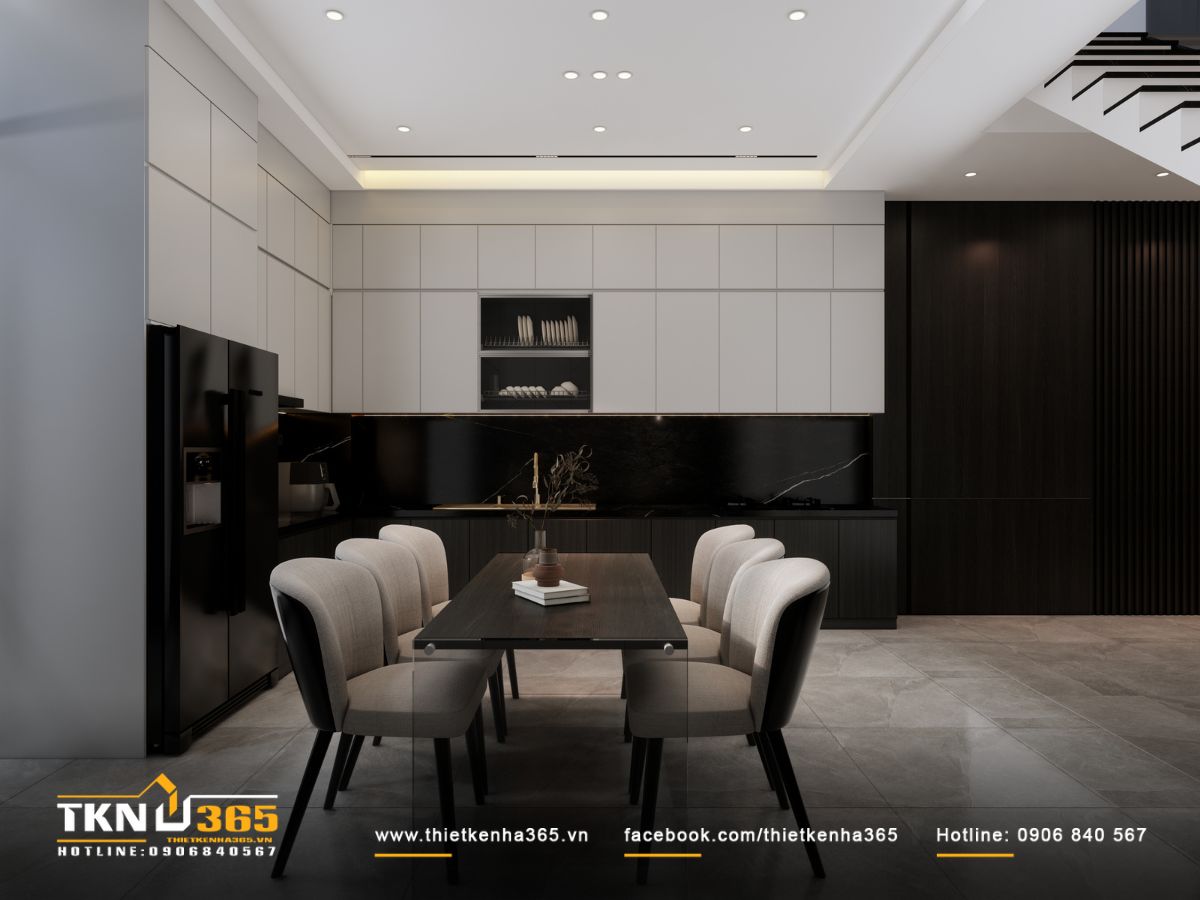 Hệ tủ bếp cao kịch trần sắc xám sáng, mặt đá đen vân mảnh tạo nên tổng thể thiết kế hiện đại