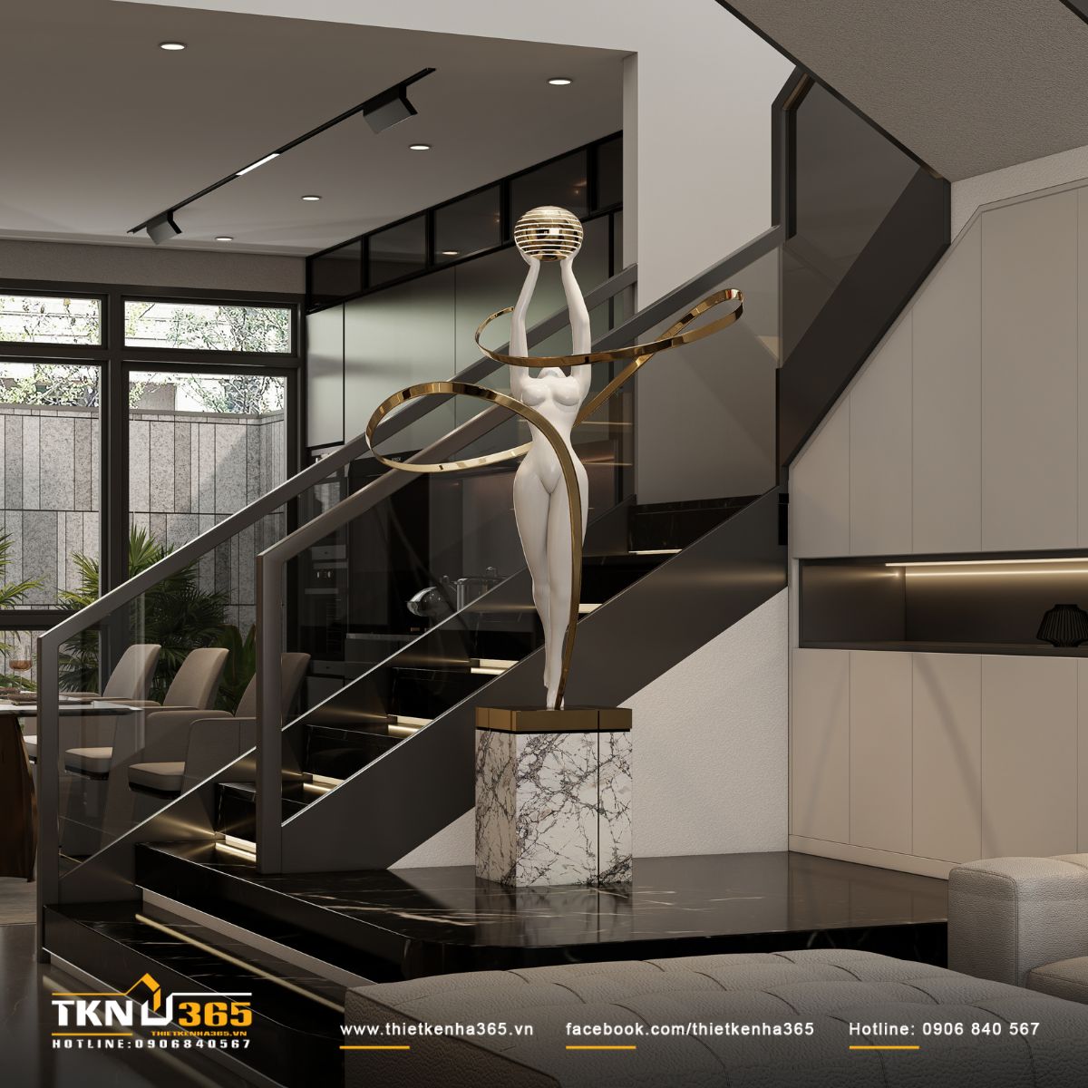 Tượng điêu khắc trắng bên cạnh cầu thang, kết hợp vòng kim loại ánh vàng uyển chuyển, phá vỡ sự cứng cáp của khối kiến trúc