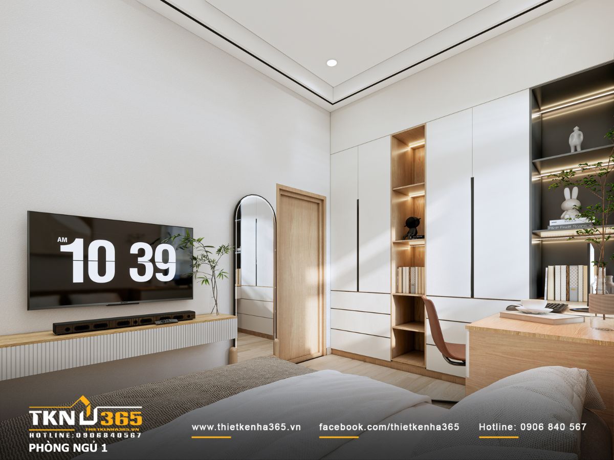 Phòng ngủ phụ gọn gàng với tủ quần áo âm tường cao kịch trần và các hộc mở làm kệ sách, đây là giải pháp lưu trữ tối ưu, hạn chế góc nhọn và dễ vệ sinh