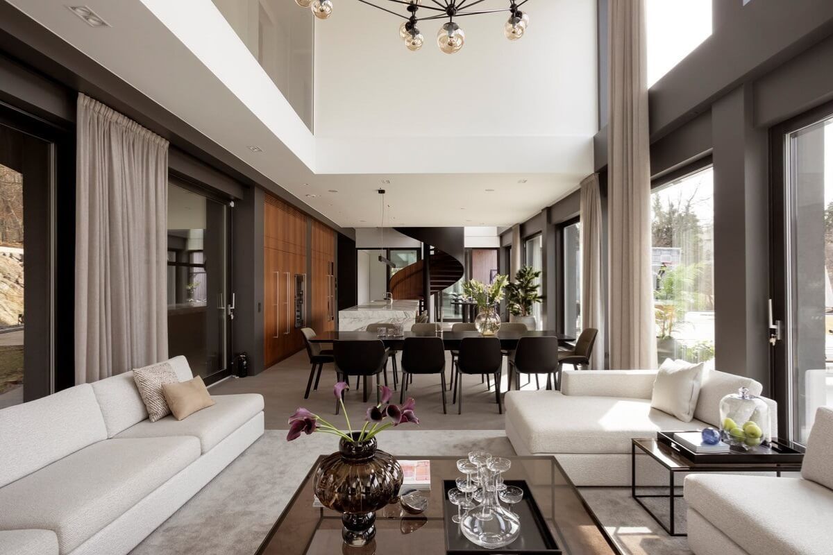 Sự thống nhất về mặt phong c&aacute;ch giữa thiết kế nội thất ph&ograve;ng kh&aacute;ch v&agrave; kiến tr&uacute;c tổng thể đảm bảo kh&ocirc;ng gian sống trong biệt thự lu&ocirc;n liền mạch, h&agrave;i h&ograve;a (Ảnh: Sưu tầm)