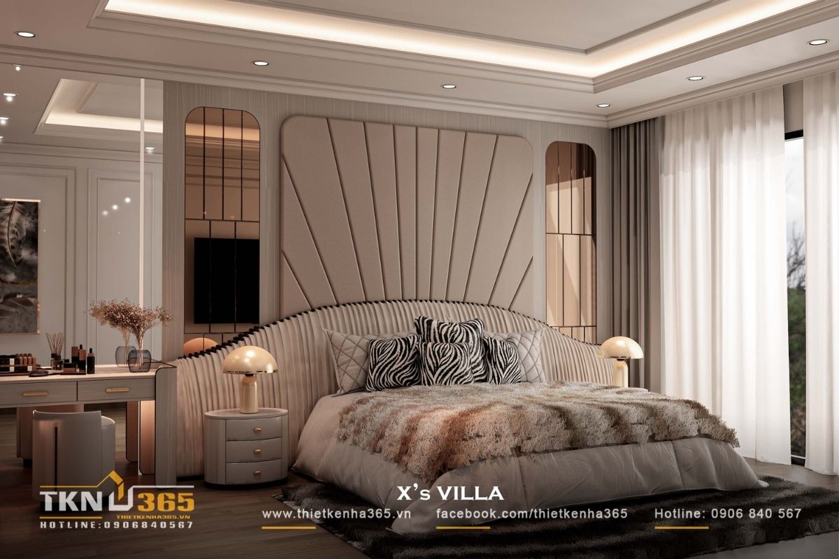 Giường ngủ đặt ở vị tr&iacute; trung t&acirc;m với đầu giường bo cong v&agrave; bọc vải mềm, tạo điểm tựa thị gi&aacute;c cho to&agrave;n bộ kh&ocirc;ng gian