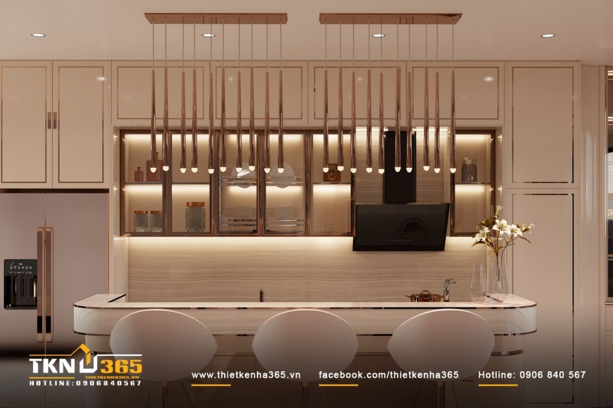 Đảo bếp bo cong kết hợp hệ đ&egrave;n thả mảnh, tạo điểm nhấn nhẹ nh&agrave;ng v&agrave; nhịp điệu thị gi&aacute;c cho kh&ocirc;ng gian bếp mở