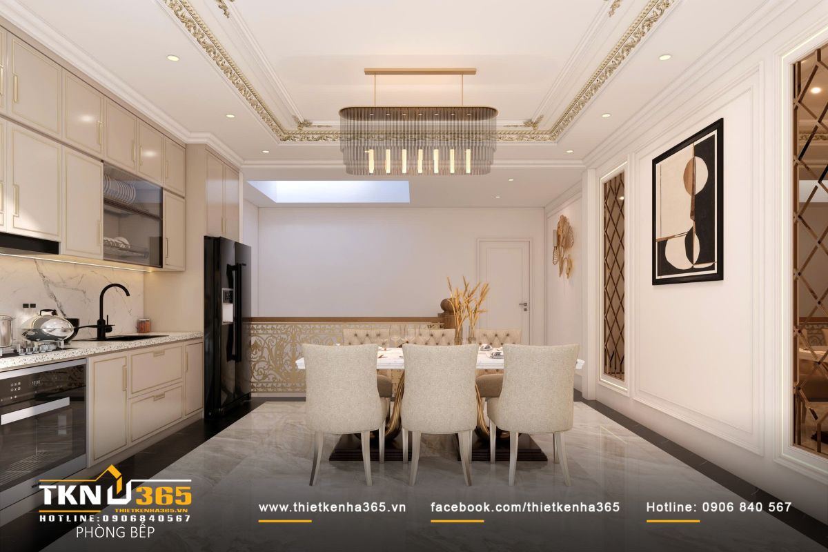 Trần bếp xử lý phào chỉ tân cổ điển tiết chế, kết hợp đèn thả hiện đại để cân bằng giữa thẩm mỹ và công năng sử dụng