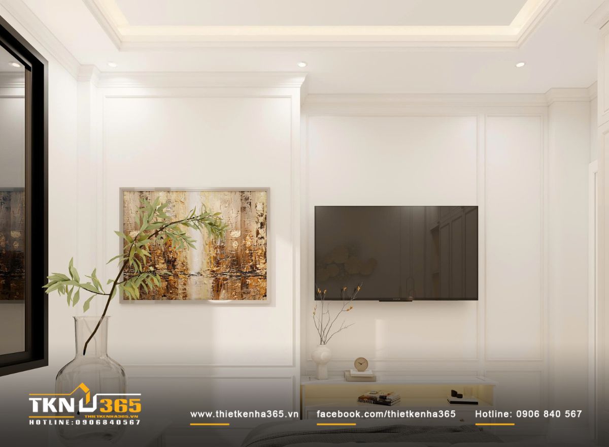 Nền tường s&aacute;ng trung t&iacute;nh kết hợp tranh treo tiết chế gi&uacute;p kh&ocirc;ng gian giữ chiều s&acirc;u cảm x&uacute;c m&agrave; vẫn dễ chịu