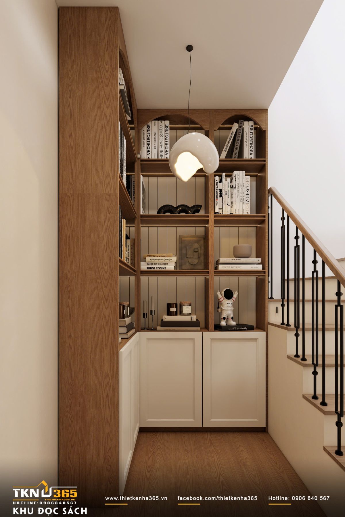 Hệ tủ gỗ chia &ocirc; đều đặn kết hợp &aacute;nh s&aacute;ng ấm, vừa lưu trữ s&aacute;ch gọn g&agrave;ng, vừa tạo điểm nhấn nội thất nhẹ nh&agrave;ng cho tầng 1 của ng&ocirc;i nh&agrave;