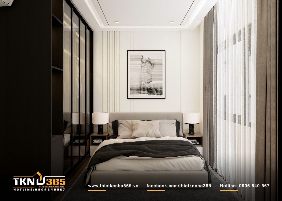 Giường ngủ đặt tr&ecirc;n trục trung t&acirc;m, kết hợp đầu giường bọc mềm v&agrave; tranh treo tối giản, mang lại sự c&acirc;n bằng thị gi&aacute;c