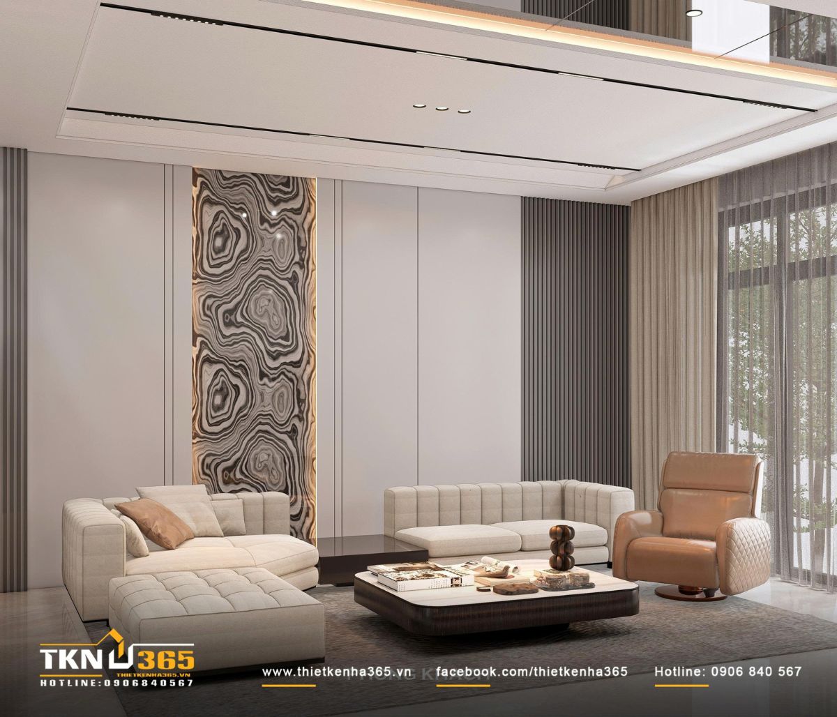 Bố cục sofa s&aacute;ng m&agrave;u kết hợp ghế thư gi&atilde;n da n&acirc;u tạo n&ecirc;n sự c&acirc;n bằng ấm &aacute;p trong bảng m&agrave;u trung t&iacute;nh