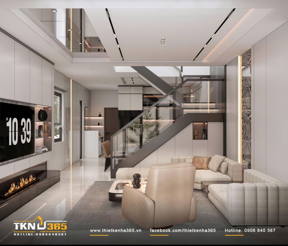 Cầu thang th&eacute;p kết hợp k&iacute;nh cường lực đặt tại l&otilde;i giữa nh&agrave; tạo kết nối xuy&ecirc;n tầng v&agrave; mở rộng cảm gi&aacute;c kh&ocirc;ng gian