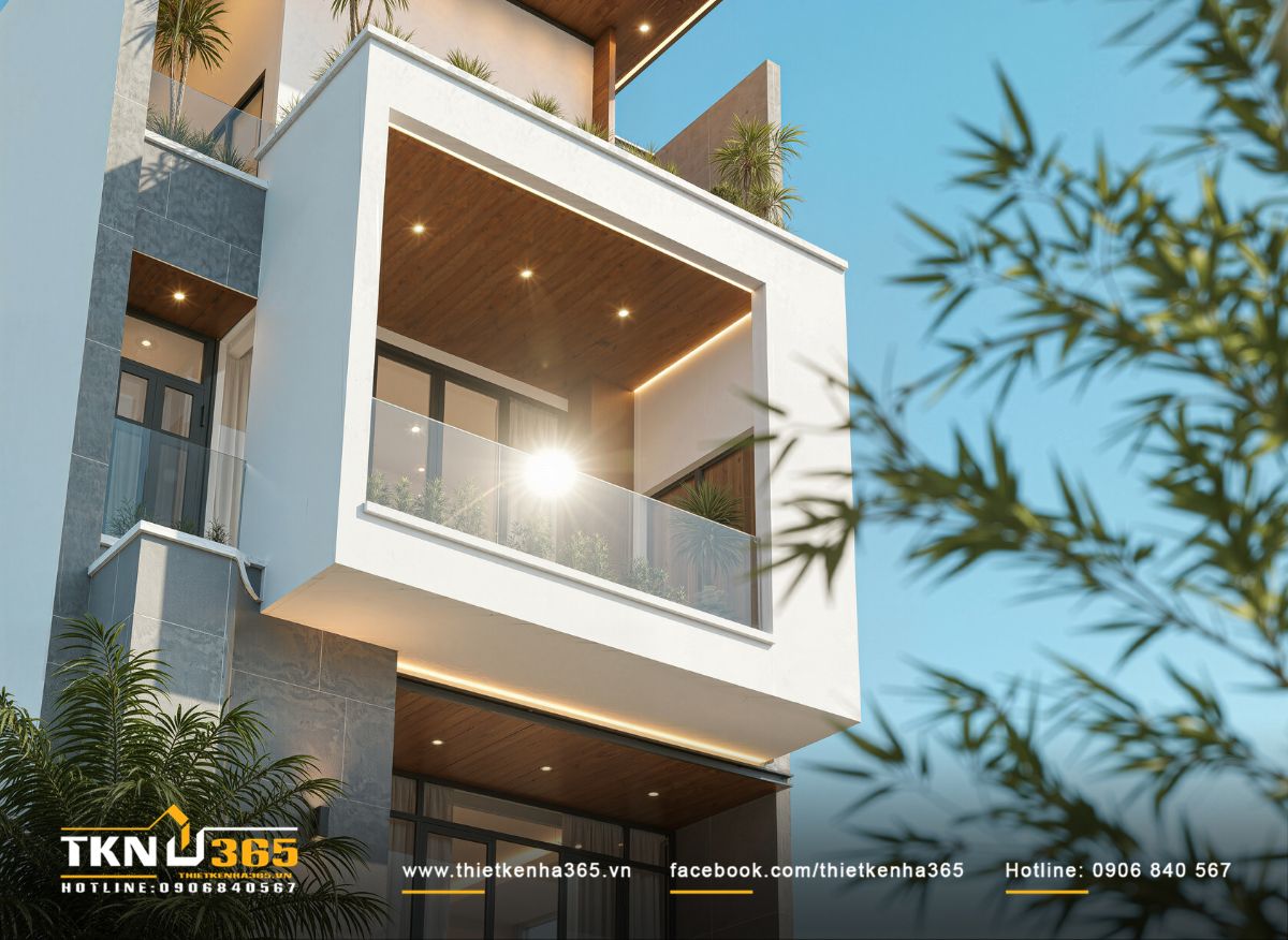 Mặt tiền nhà phố 4 tầng được cân bằng giữa vật liệu đá xám, kính và gỗ, mang lại cảm giác vững chãi ở tầng thấp và nhẹ nhàng ở các tầng trên