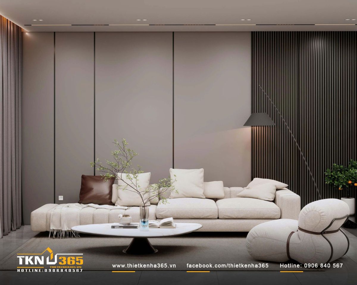 Sofa vải s&aacute;ng kết hợp ghế lounge bo tr&ograve;n v&agrave; b&agrave;n tr&agrave; thấp định h&igrave;nh bố cục trung t&acirc;m, giữ nhịp điệu mềm mại giữa c&aacute;c mảng tường phẳng ph&iacute;a sau