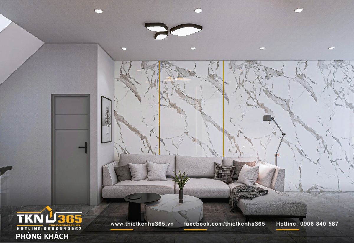 Ph&ograve;ng kh&aacute;ch sử dụng bảng m&agrave;u trung t&iacute;nh l&agrave;m chủ đạo, mảng tường đ&aacute; v&acirc;n m&acirc;y khổ lớn kết hợp chỉ &aacute;nh kim tạo chiều s&acirc;u thị gi&aacute;c