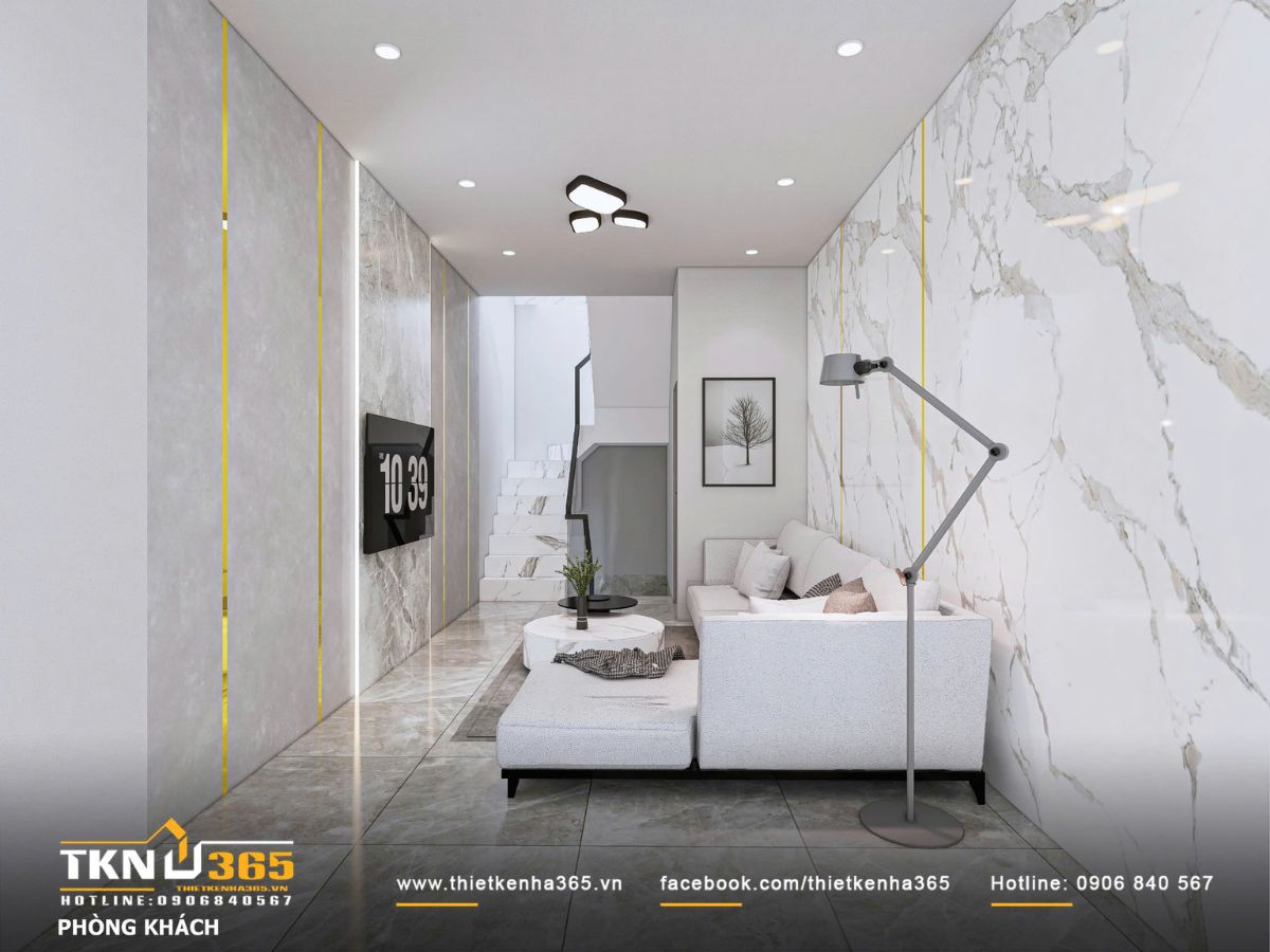 Thiết kế ph&ograve;ng kh&aacute;ch nhấn mạnh sự liền mạch kh&ocirc;ng gian, &aacute;nh s&aacute;ng &acirc;m trần v&agrave; đ&egrave;n c&acirc;y &aacute;nh v&agrave;ng dịu gi&uacute;p tổng thể nhẹ nh&agrave;ng v&agrave; ấm &aacute;p