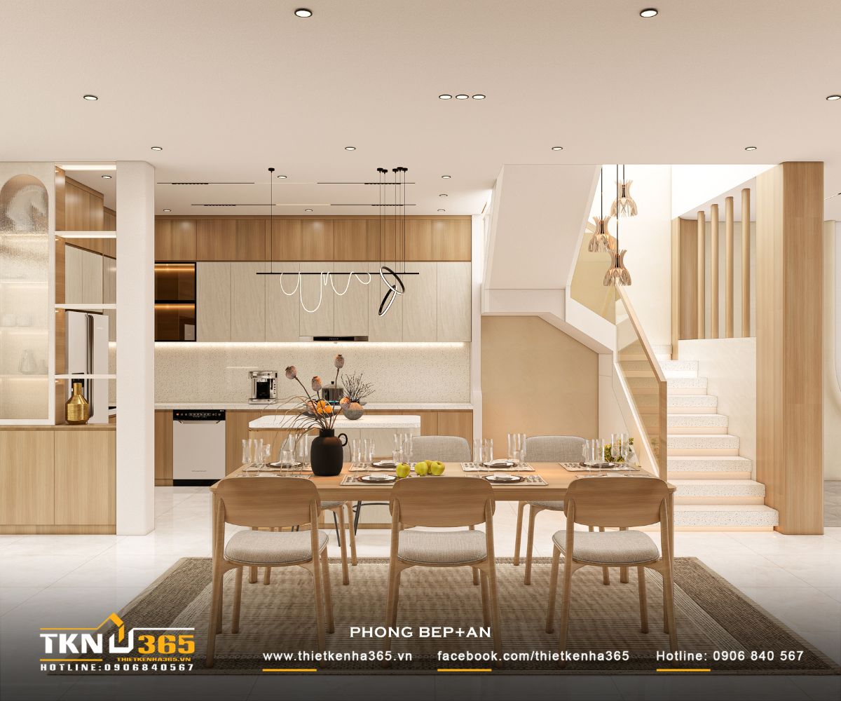 Khu bếp bố trí gọn gàng với hệ tủ chữ L kết hợp đảo bếp trung tâm, tối ưu công năng sử dụng