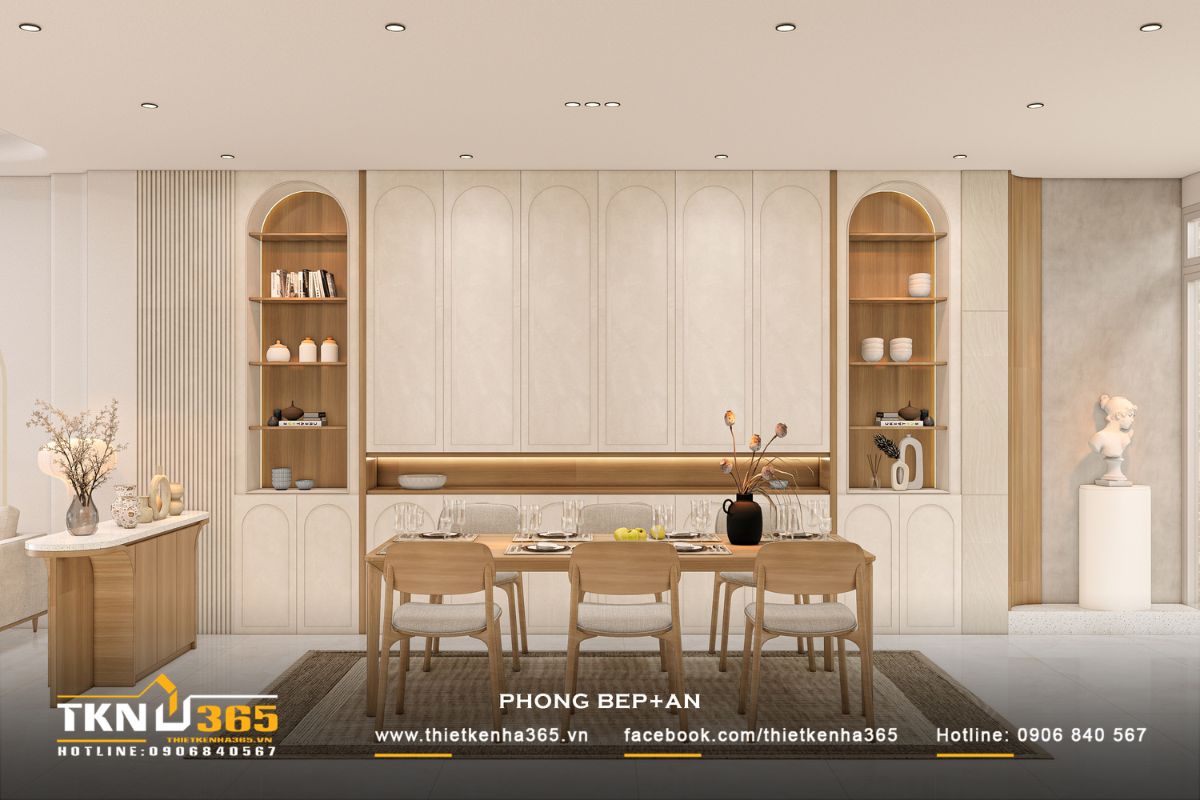 Mảng tường phía sau bàn ăn nổi bật với hệ đường cong lặp lại mềm mại, kết hợp ánh sáng hắt tạo chiều sâu và mang đến cảm giác nhẹ nhàng, thư giãn