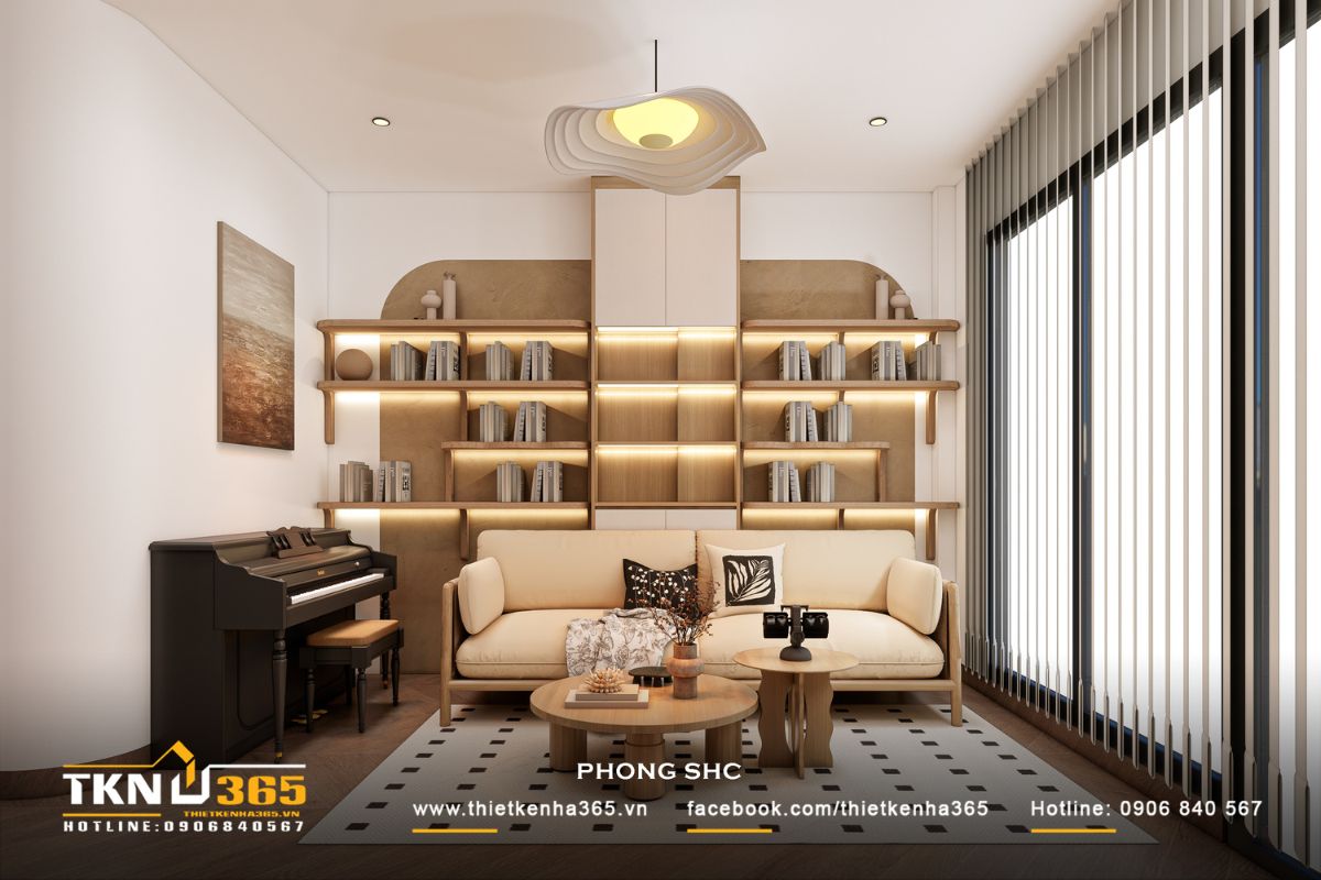 Không gian sinh hoạt chung nhà phố 3 tầng được thiết kế như một “khoảng nghỉ” với sofa, bàn trà và kệ sách, tạo nên nơi thư giãn nhẹ nhàng cho cả gia đình