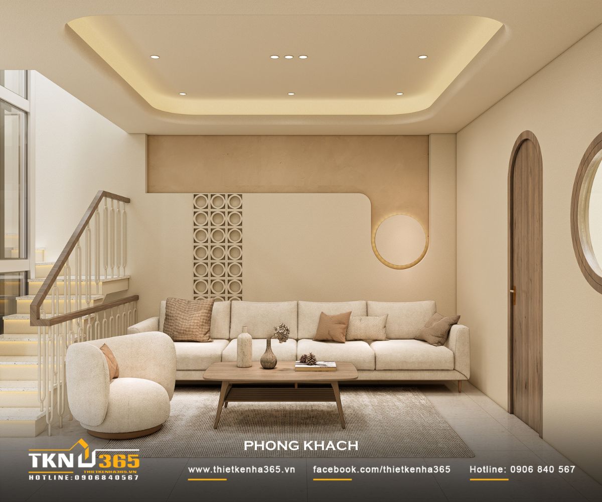 Phòng khách nhà phố 5 tầng nổi bật với sofa bo cong và bảng màu trung tính, tạo cảm giác nhẹ nhàng và thư giãn