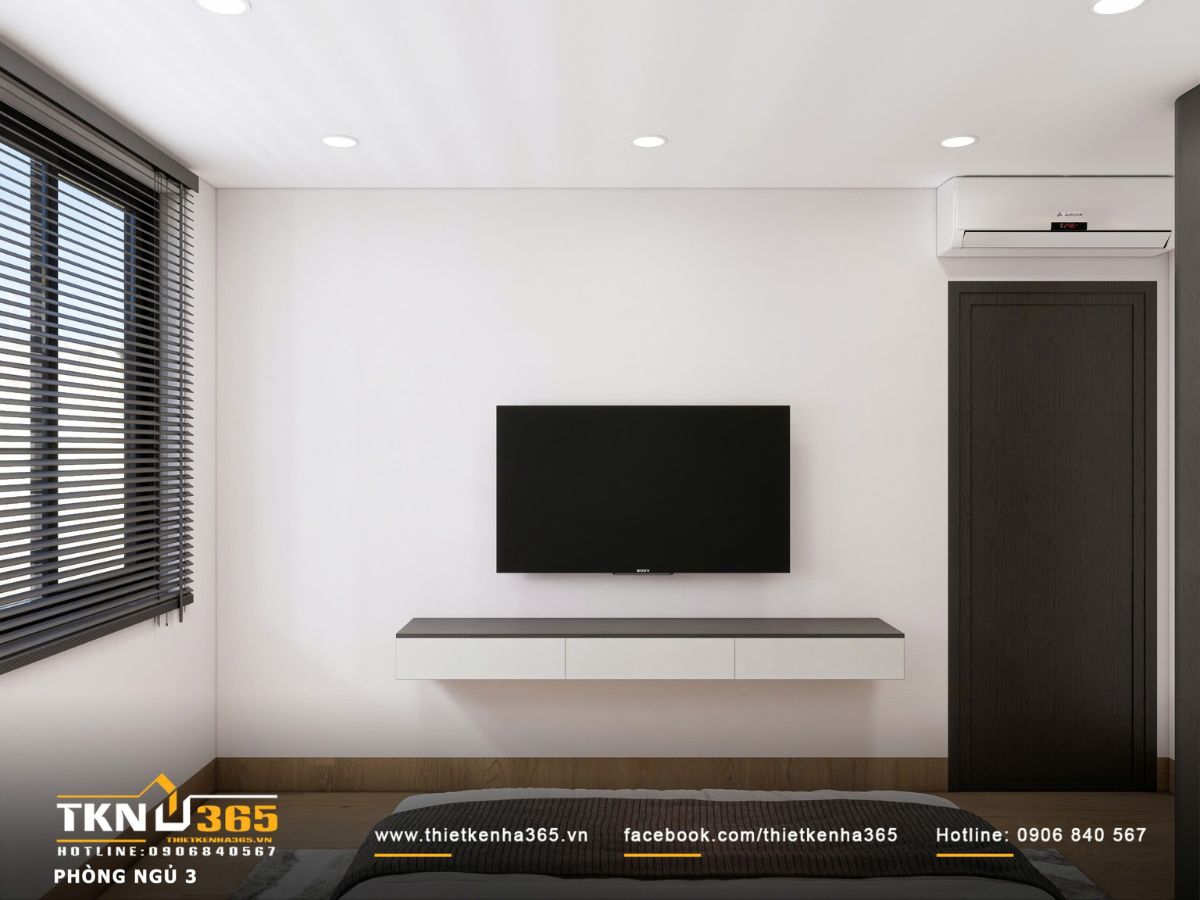 Thiết kế nội thất biệt thự hiện đại 1 trệt 2 lầu ở Bình Tân | Nhà Chị Hương 24 Kệ TV treo tường thiết kế tối giản, kết hợp mảng tường trắng giúp không gian gọn gàng và hiện đại