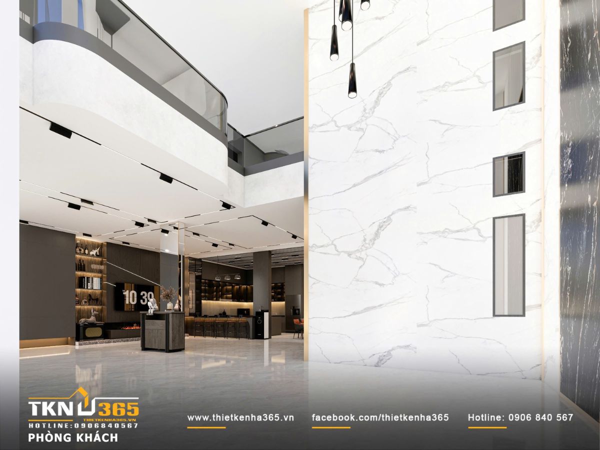 Không gian mở kết nối phòng khách - bếp - ăn với vật liệu trầm và ánh sáng gián tiếp tạo nên tổng thể sang trọng, thống nhất