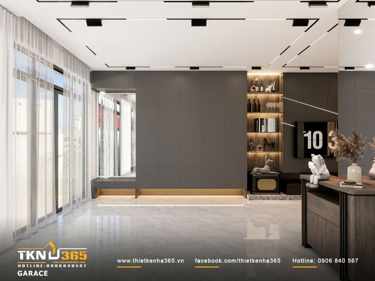 Mảng tường phẳng màu xám đi cùng ánh sáng hắt chân tường giúp giảm khối tích, đồng thời làm mềm tổng thể vật liệu nặng