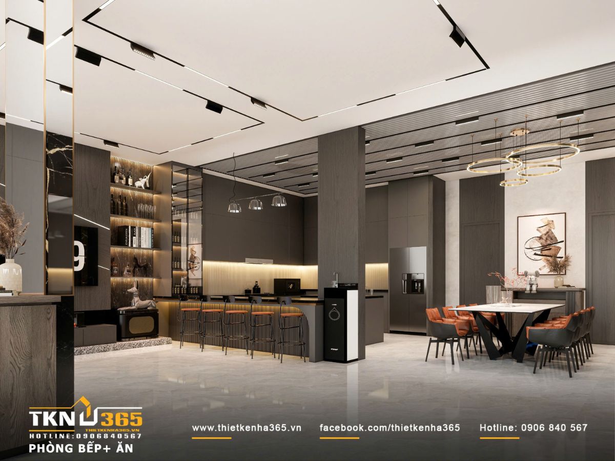 Không gian bếp - ăn liên kết mở với bảng màu xám trầm và ánh sáng gián tiếp, tạo tổng thể ấm và đồng nhất