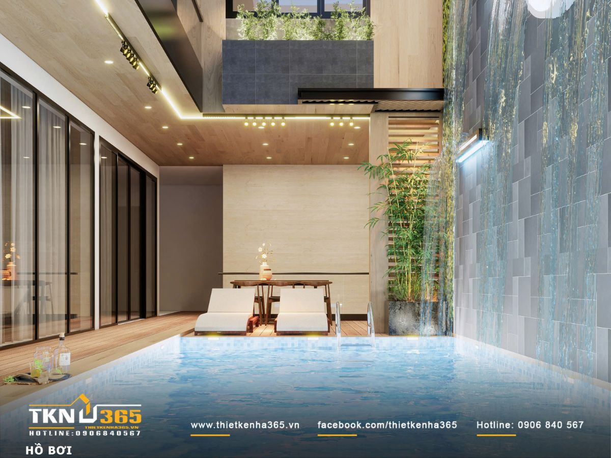 Hồ bơi và tường nước thể hiện rõ vai trò trung tâm điều tiết vi khí hậu của toàn bộ công trình