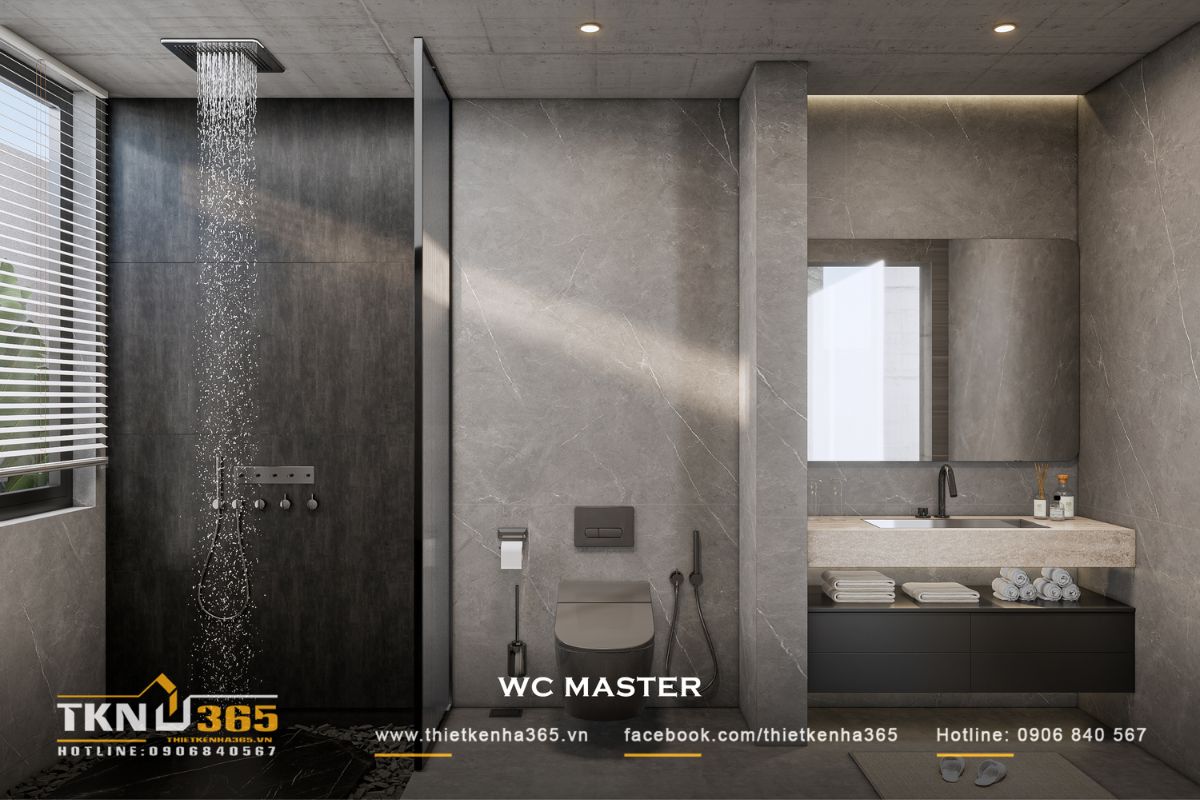 WC master sử dụng bảng màu xám đồng nhất từ trần, tường đến sàn, kết hợp vách kính để phân chia khu tắm mà vẫn giữ không gian liền mạch