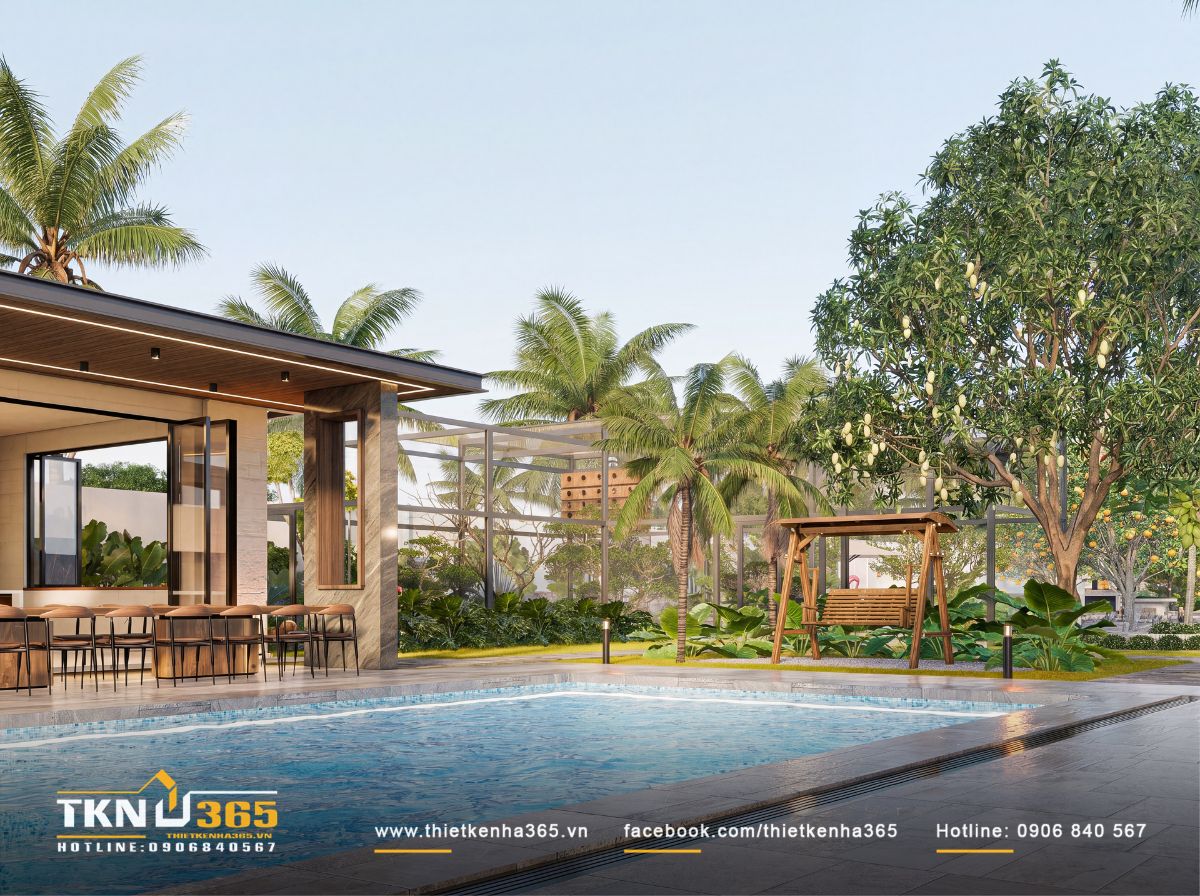 Hồ bơi nằm giữa khối nhà và mảng xanh rộng, đưa hoạt động thư giãn ngoài trời đến gần khu vực sinh hoạt chung